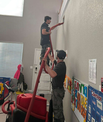 Air ducting cleaning repairman in attic